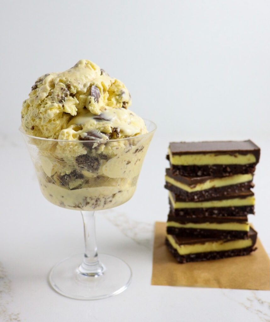 Bowl of Nanaimo Bar ice cream with stack of Nanaimo Bars