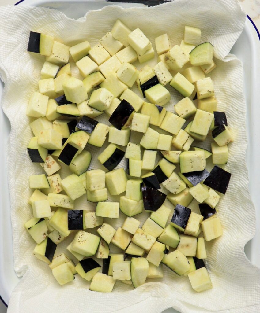Eggplant cubes sitting in salt
