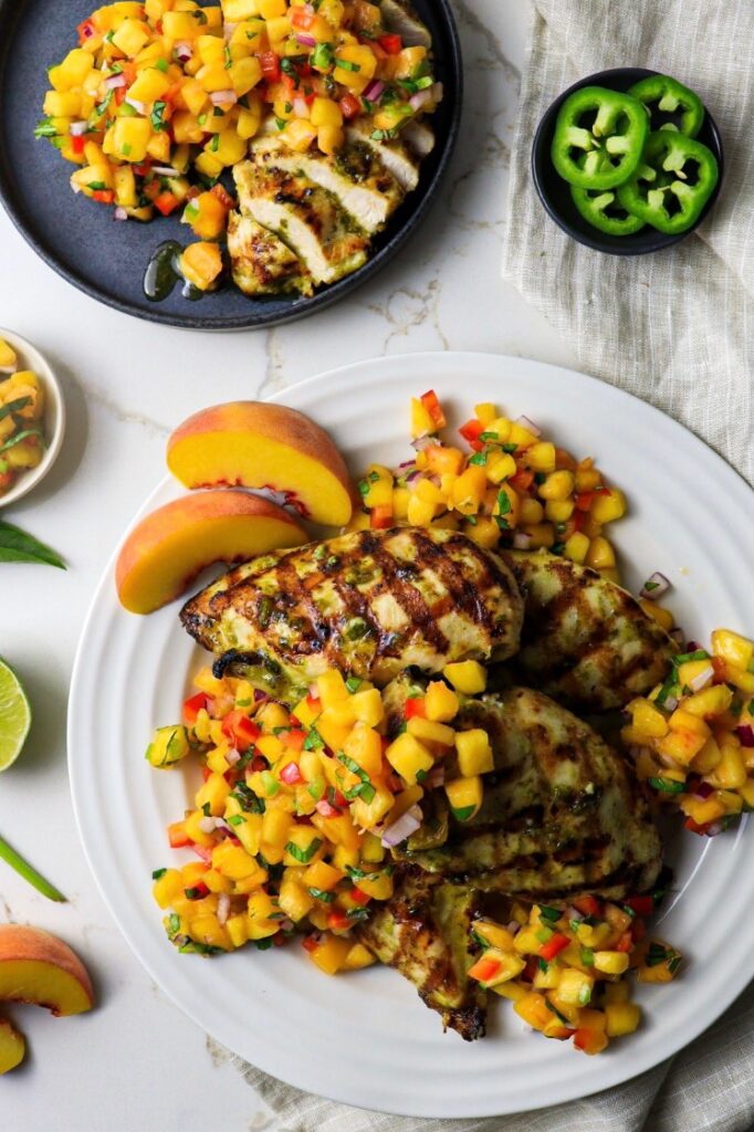 Grilled chicken recipe with basil lime chicken marinade, honey drizzle, and peach salsa