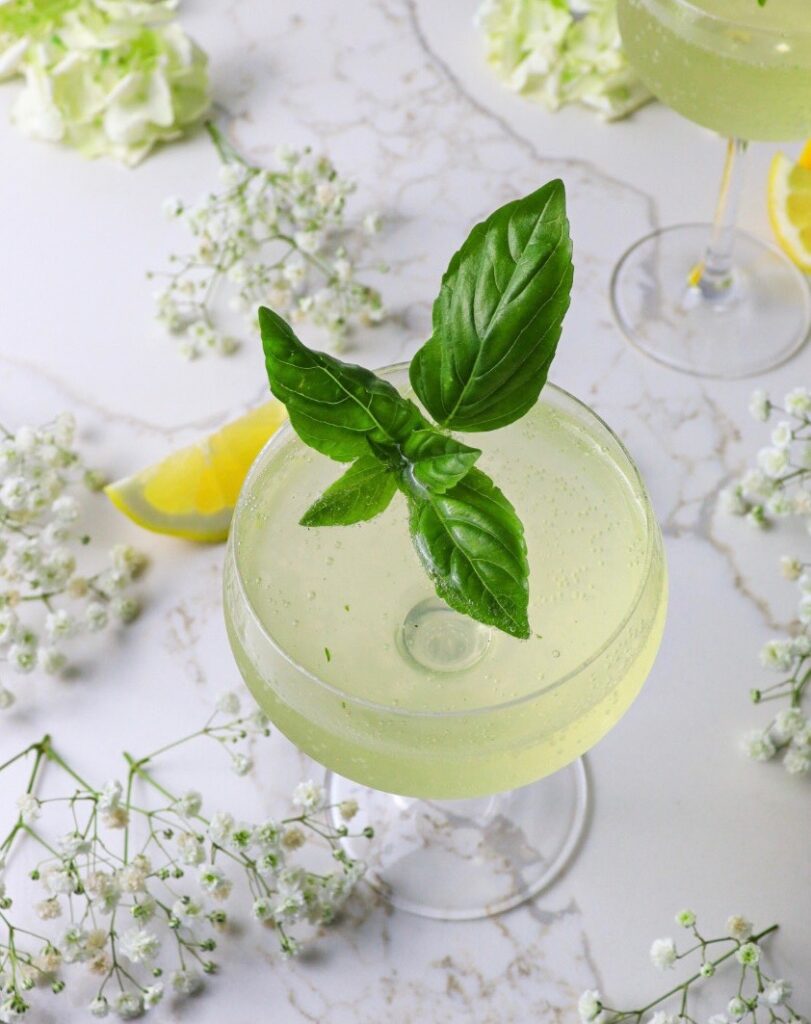 Glass of limoncello basil fizz