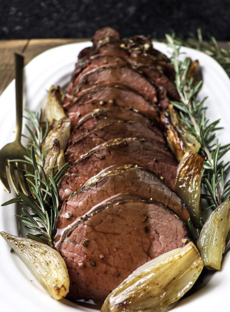 slow-roasted beef tenderloin with roasted shallots and port wine sauce