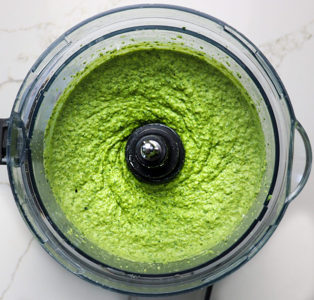 blended spinach and artichoke hummus appetizer