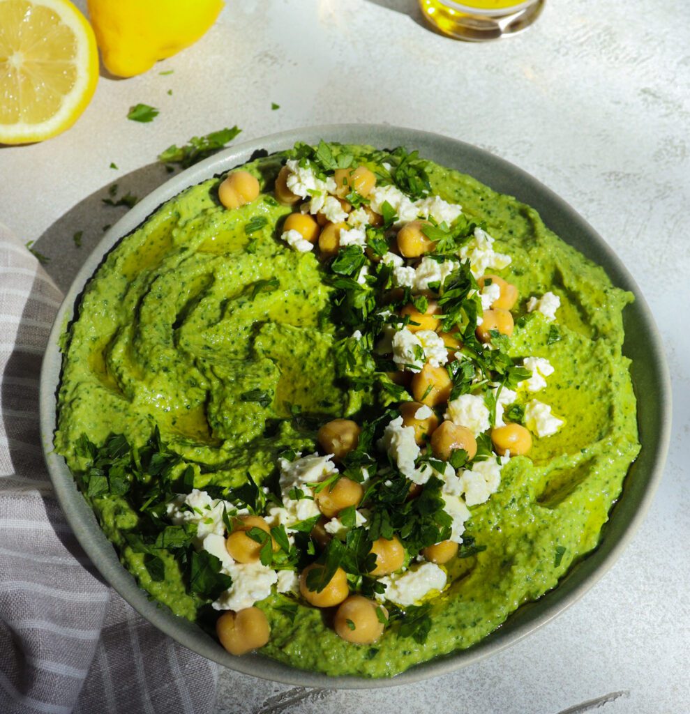 hummus appetizer with spinach and artichoke dip