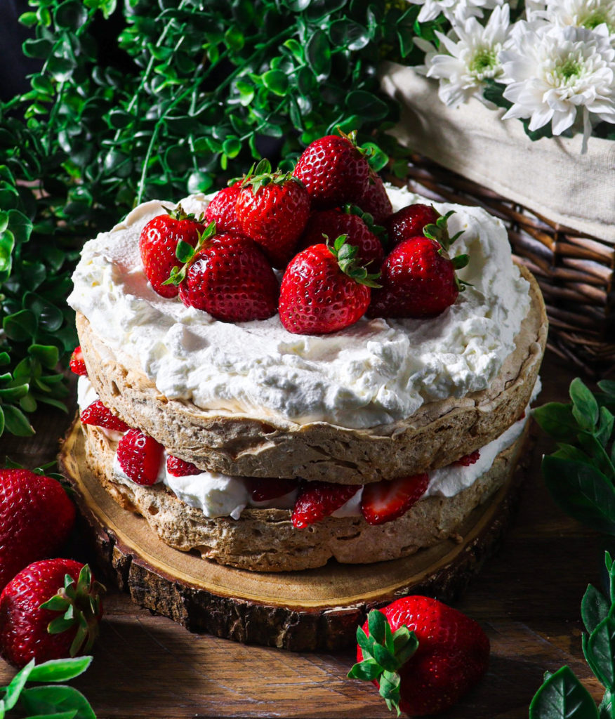 hazelnut meringue cake with strawberries and cream