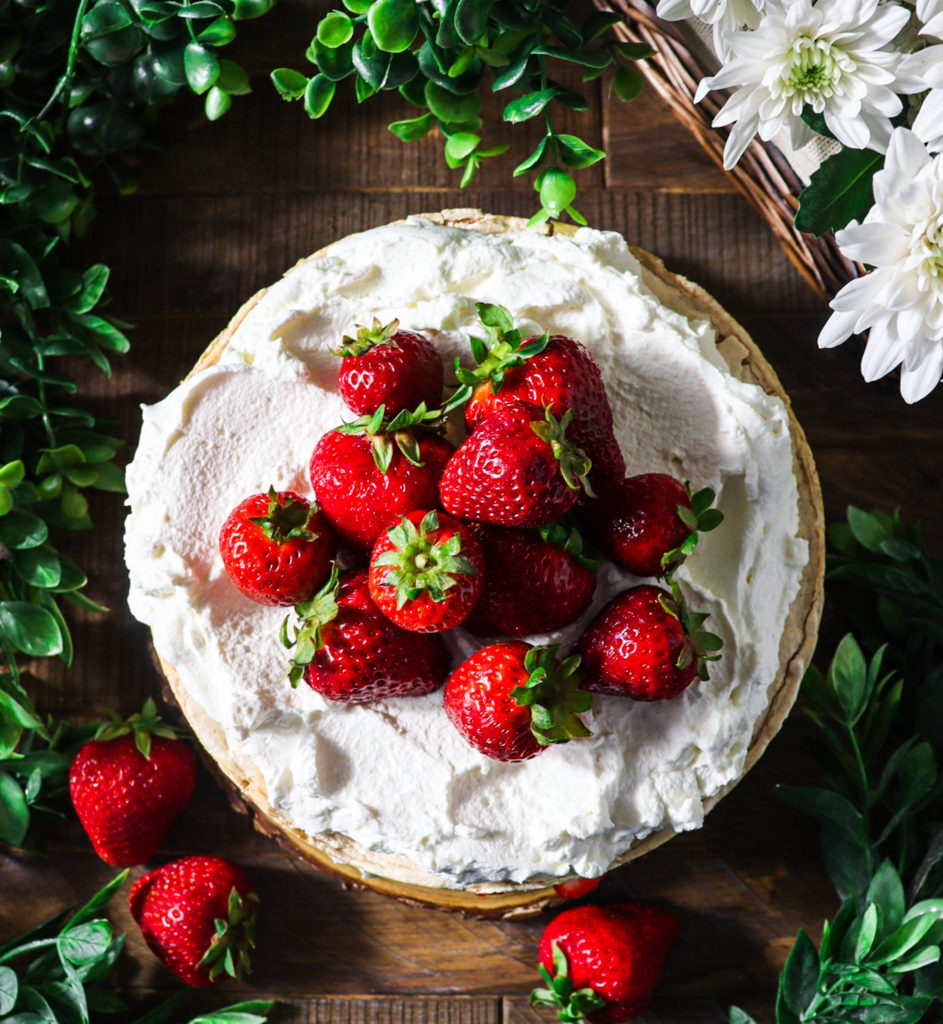 hazelnut meringue cake with strawberries and cream